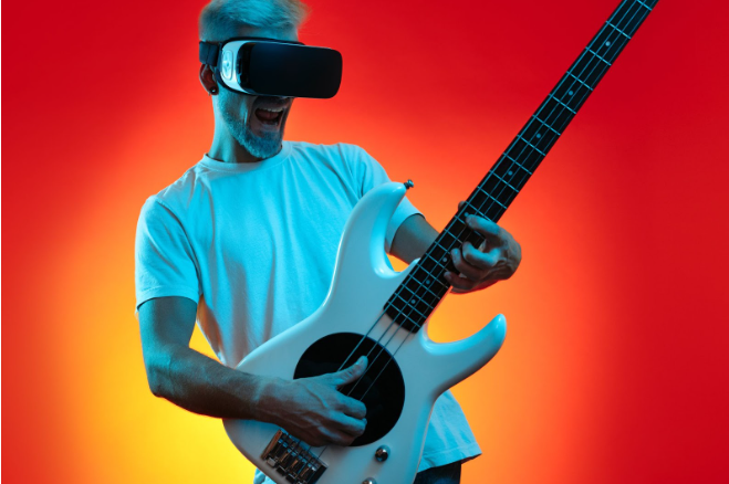 Person playing electric guitar with VR headset for virtual music experience